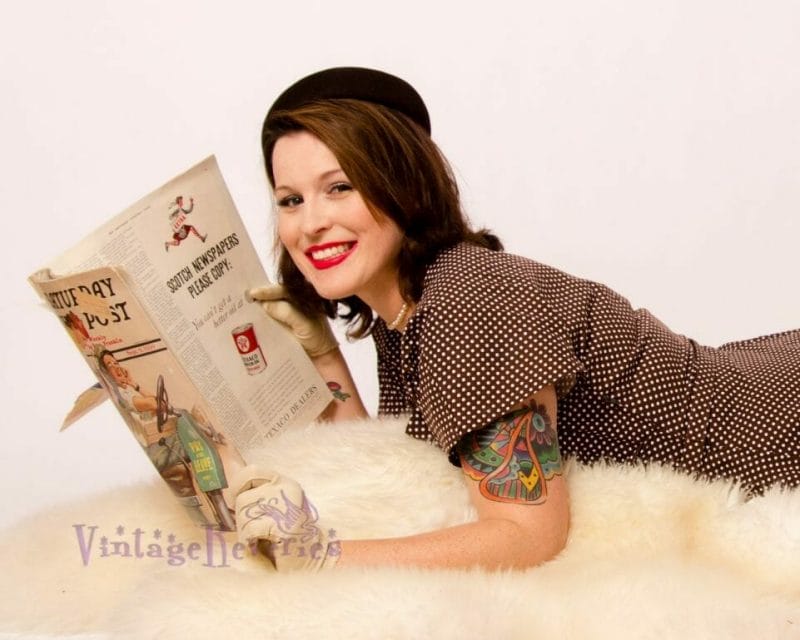 model posed with an old magazine