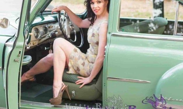 Pinup model with a green vintage car